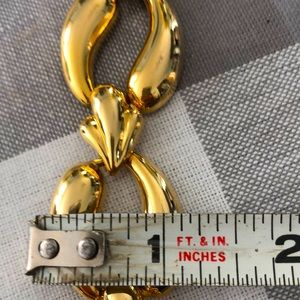 Three piece costume goldtone set. bracelet, earrings, and necklace